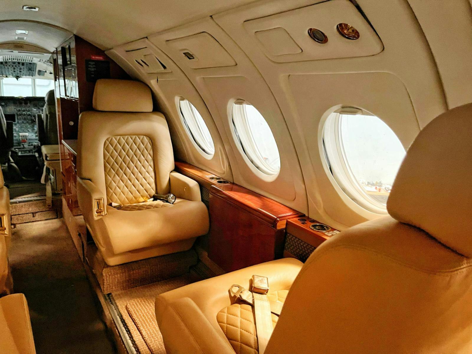 Inside of the cabin of a private jet.